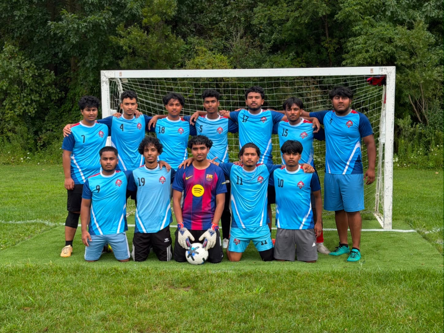 Youngstars FC members who played in a recent outdoor match, together in front of the goal